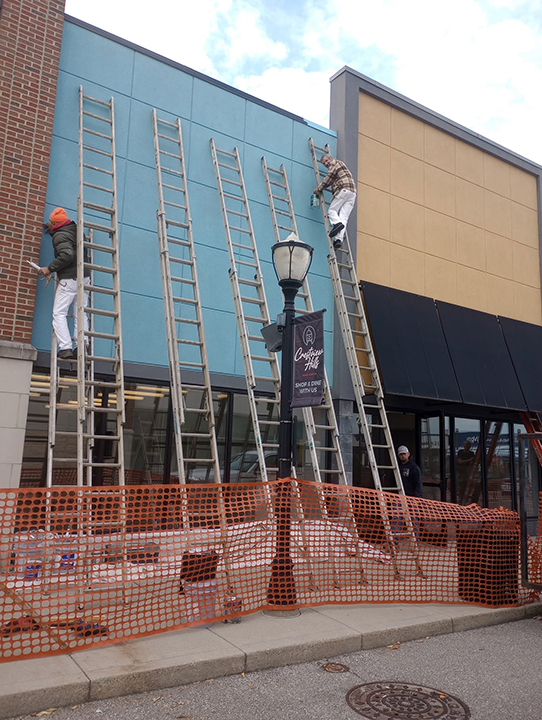Crew performing exterior work on a commercial building in Crestview Hills, Kentucky