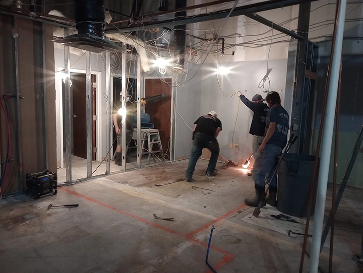 All Bills Construction crew performing commercial interior construction work